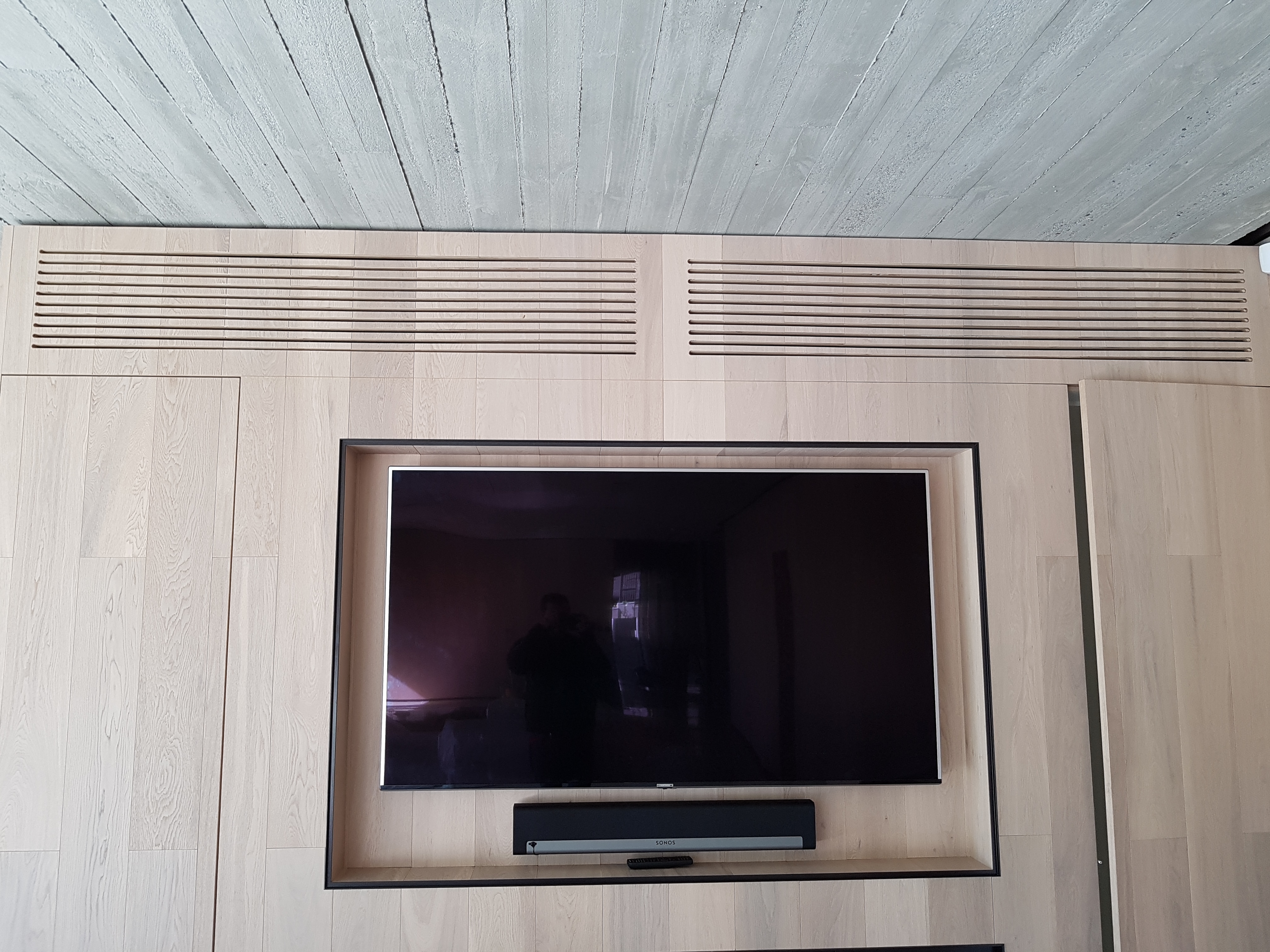 Concealed ducted AC above TV wall